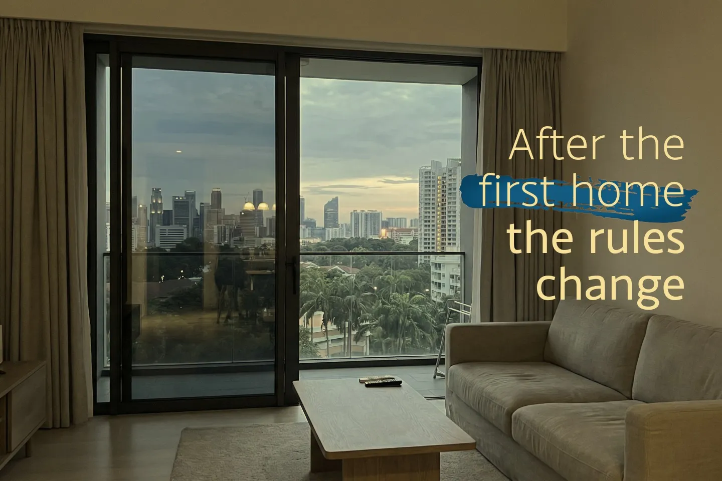 Interior view of a Singapore home looking out toward the city at dusk